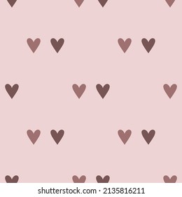 Pattern brown hearts on a pink background