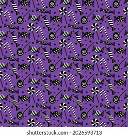 Pattern with candies for halloween. Vector illustration on a purple background. Various sweet attributes for the holiday. For holiday decoration, prints, packaging, postcards, decorative work, fabrics