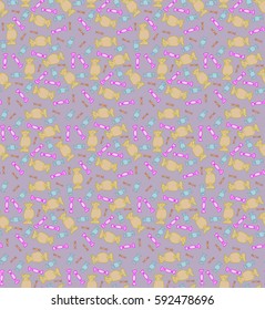 Pattern with candies on the purple background