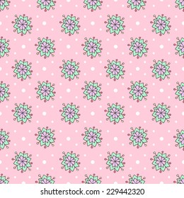 Pattern of cartoon colored snowflakes on a pink background