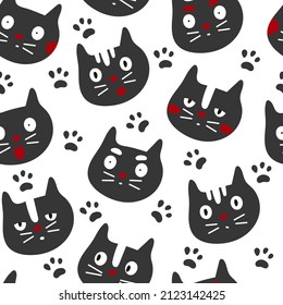 Pattern of cat faces on a white background with paw prints. Cartoon cats pattern.