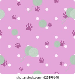 Pattern with cat paws and balls of yarn on pink background. Vector illustration.