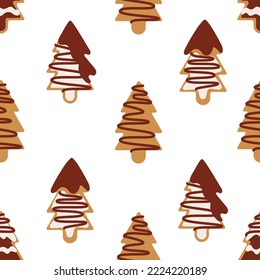 Pattern Christmas homemade cookies in the shape of Christmas trees in chocolate and icing on a white background