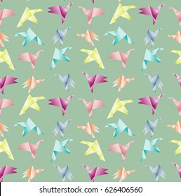 Pattern with colored origami birds on the green background
