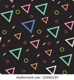 pattern of colored triangles, rings, rectangles on a dark background