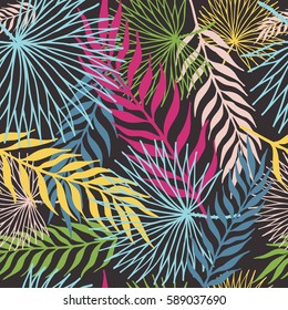 Pattern of colored tropical leaves. On a black background. Seamless.