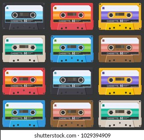 Pattern of compact cassettes on a dark background.