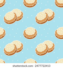 Pattern of cookies with white icing, sprinkled with sesame seeds, on blue background. Vector illustration