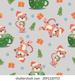 Pattern of cute tiger cubs on a gray background The image is perfect for New Year and Christmas ads.