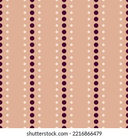 Pattern of dots on a beige background. Cute polka pattern