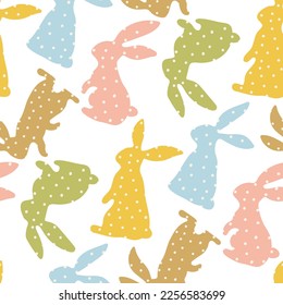 Pattern of Easter bunnies made of polka dot fabric sewn. Rabbit toys for children. Rabbit or hare, a spring festive animal for Easter. Cartoon festive simple vector character made of fabric.