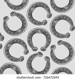 Pattern from ensemble horse horseshoes on gray background