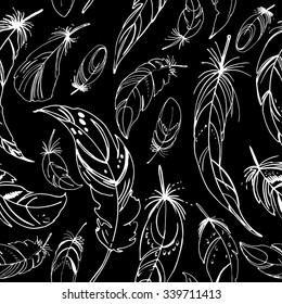 Pattern of ethnic feathers. Ethnic set in native style. Feathers and beads on black background. Vector decorative elements hippie