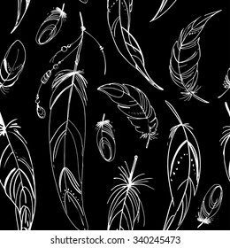 Pattern of ethnic feathers. Ethnic set in native style. Feathers and beads on black background. Vector decorative elements hippie