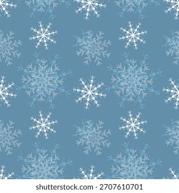 Pattern of figured white snowflakes on blue background, winter background, cold frosty pattern.