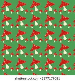 pattern of fly agaric mushrooms on a green background