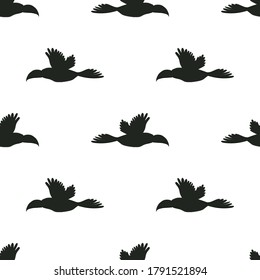 Pattern with flying toucans. Vector seamless texture.