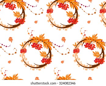 The pattern in the form of a circle formed by the branches and berries of rowan. The pattern in the autumn style on a white background. Also on the background can be seen maple leaves.