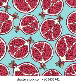 Pattern of fruits pomegranate on a blue background. Seamless.