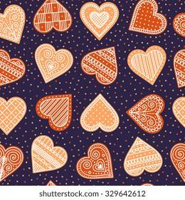 Pattern with gingerbread hearts. Cute Christmas background with hand drawn cookies. Seamless winter pattern. Brown colors.