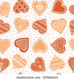 Pattern with gingerbread hearts. Cute Christmas background with hand drawn cookies. Seamless winter pattern. Brown colors.