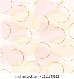 Pattern with golden circles and chaotic stains on a pink background
