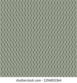 Pattern in green and ivory, with dots, dashes and small parallelogram shapes. Textile print. Decorative mesh background. Vector illustration.