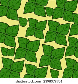 The pattern is green leaves on a yellow background