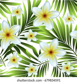 Pattern with green tropical palm leaves and white tropical flowers