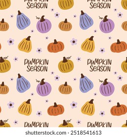 Pattern with hand drawn pumpkins and small flowers. Pumpkin season lettering. Vector illustration.