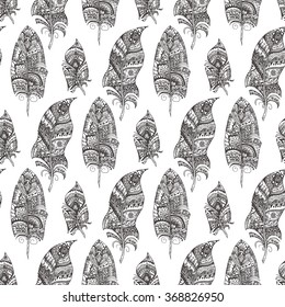 Pattern with hand-drawn feathers. Tribal ornament. Ethnic doodle pattern. Seamless pattern in black and white. Adult coloring book page design. Vector illustration. Zen doodle.