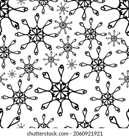 A pattern of hand-drawn snowflakes with a white background. Vector illustration with doodles. An element for greeting cards, posters, stickers and seasonal design.