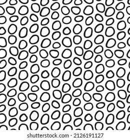 Pattern with handwritten rings. Abstract form of bubbles. Seamless monochrome texture with black and white eyelets in doodle style. Hand-drawn shapes of rounded loops for modern backdrops, wallpapers.
