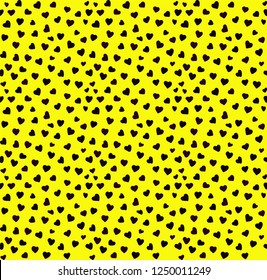 A pattern of hearts. Small black hearts, yellow background. Good for postcards, packaging, banner. Simple seamless pattern.