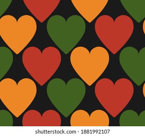 pattern with hearts in traditional Pan African colors - red, yellow, green, black background. Backdrop for Kwanzaa, Black history month, Black Love Day, Juneteenth greeting card, banner