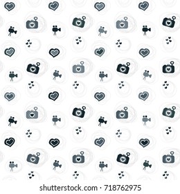 The pattern with the image of the camera, the video camera and the hearts. vector. It can be used for greeting cards, advertisements, brochures, background etc.