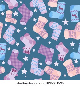 pattern of Knitted children's socks in pastel color with patterns, warm winter clothes drawn in cartoon style, knitted clothes, socks vector illustration  on a blue  background