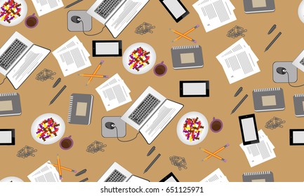 Pattern of a laptop and a trifle. The gray notebook is on the table, near two pencil. The spiral-bound pad for notes. Candy with coffee.