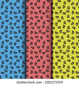 Patrón - hojas. Hojas negras combinadas con fondo azul, rojo y amarillo.