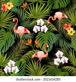 Pattern with leaves and flamingos.Palm leaves, tropical flowers and flamingos on a black background in a vector pattern.