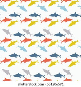 Pattern of many colorful small sharks. Seamless abstract ornament. Vector illustration.