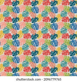 A pattern of multicolored monstera leaves on a light background