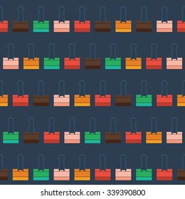 pattern with multi-colored stationery clip on a dark blue background