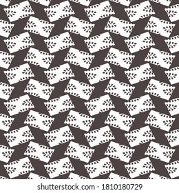 Pattern on a black background with partial shoe traces in white rectangles. Textile design.
