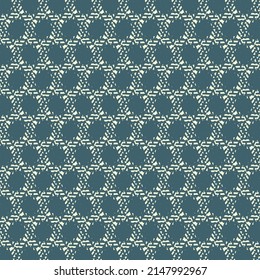 Pattern on a broken mesh structure, with oval spots arranged linearly and in a slightly inclined position. Artwork in blue and white.