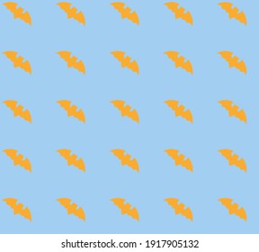 Patrón. Murciélagos naranjas sobre un fondo azul.