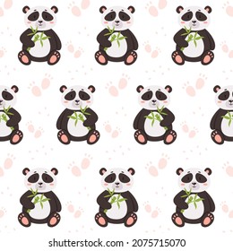 los pandas patrón están sentados y sosteniendo el bambú en sus patas 