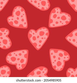 A pattern of pink heart with and texture dots of different sizes on a red background. Seamless pattern of a hand-drawn isolated heart with circles inside, chaotically on a red. symbol of love 