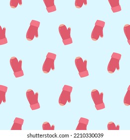 Pattern of pink mittens. Knitted warm mittens on a pattern for textiles, wallpapers, backgrounds.

