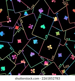 Pattern with playing cards. Multi-colored playing cards scattered on the table on a black background. Suits of playing cards. Spades, Hearts, Clubs, Diamonds.
